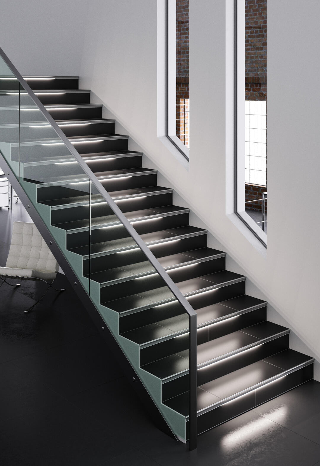 Eine Treppe mit weiß leuchtenden Treppenstufen in einem modernen, schnörkellosen Innenraum.